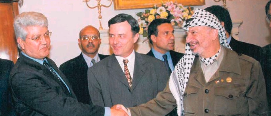 Yasser Arafat talks to Israeli Deputy Prime Minister David Levy while in Malta for the Euro-Arab Med Conference in Malta (April 1997) as Maltese Prime Minister Alfred Sant looks on.